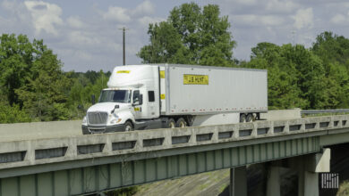 A J.B. Hunt tractor-trailer crossing a bridge