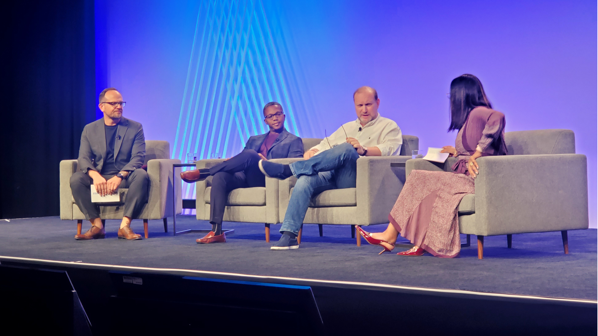 4 Panelists sit on stage at Amazon Business