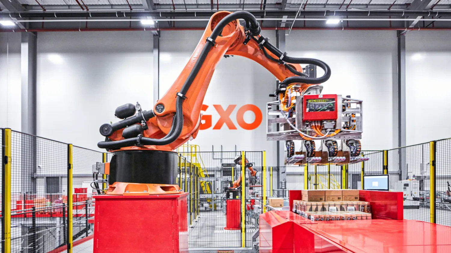 GXO robot arm in warehouse setting