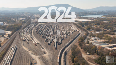 An aerial photo of a rail yard that has several parked trains. The number 2024 is written near the top of the photo.